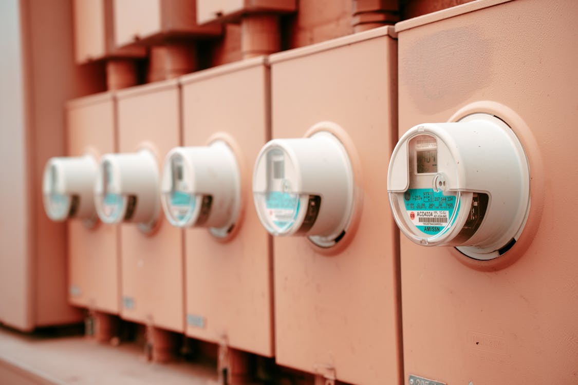 Row of electricity meters — the mechanism behind Australian LED rebate schemes